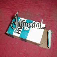 NOS Mopar Headlight Door Nameplate 1970-1 Imperial Models